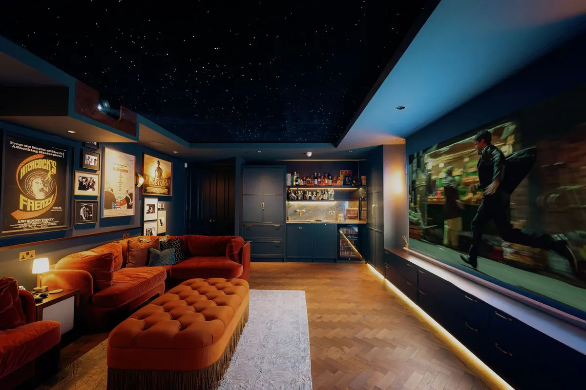Cinema room with velvet seating and a starlit ceiling
