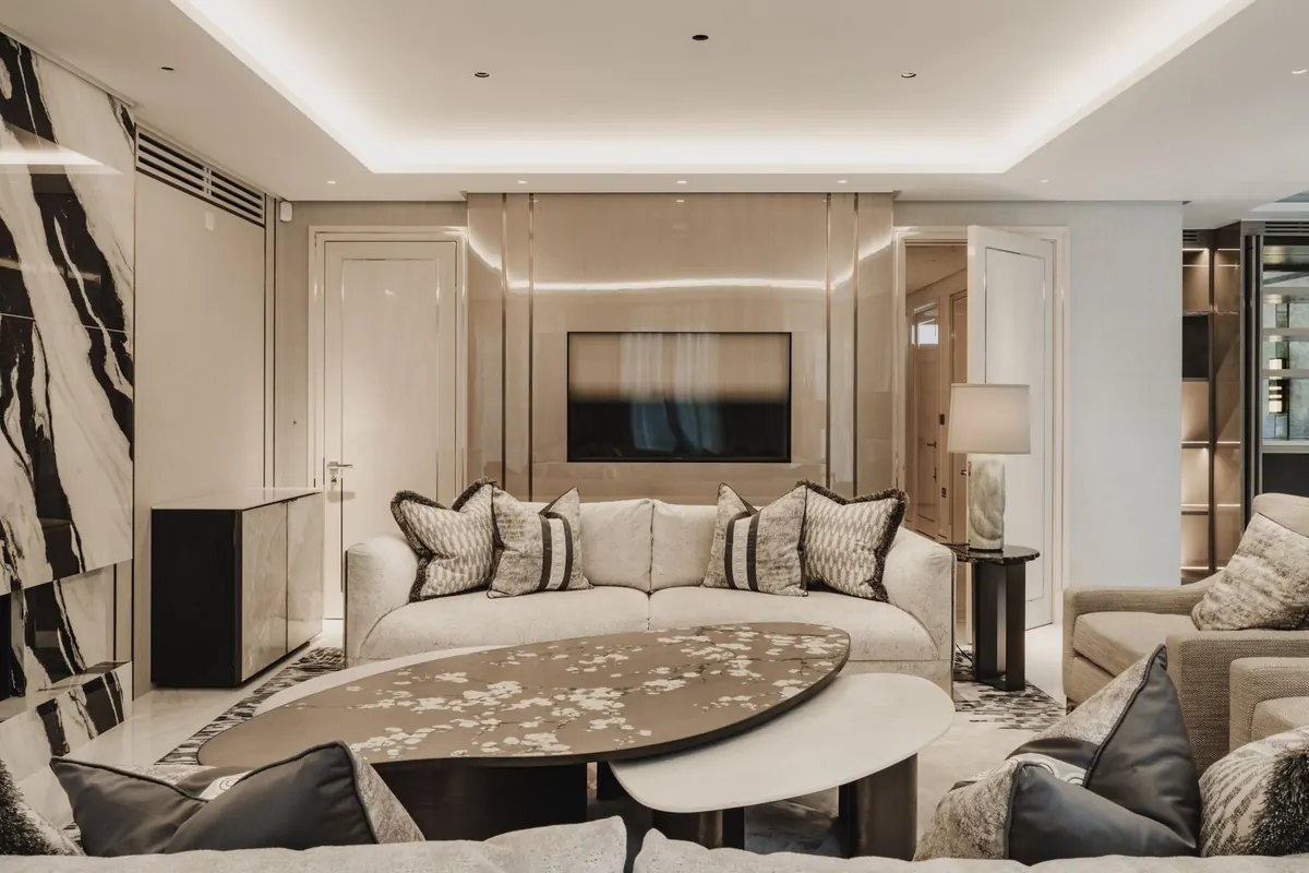 Living room with media wall and cove lighting
