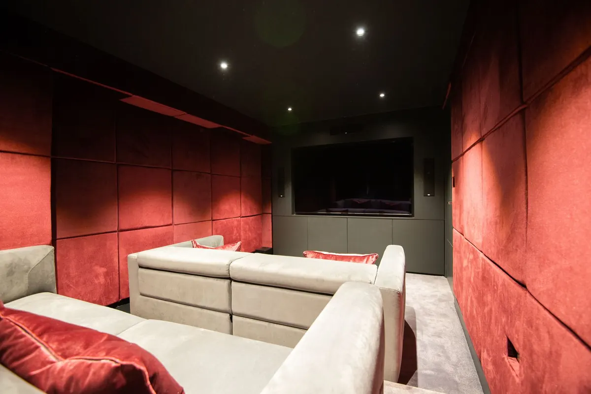 Media room in red velvet panelling