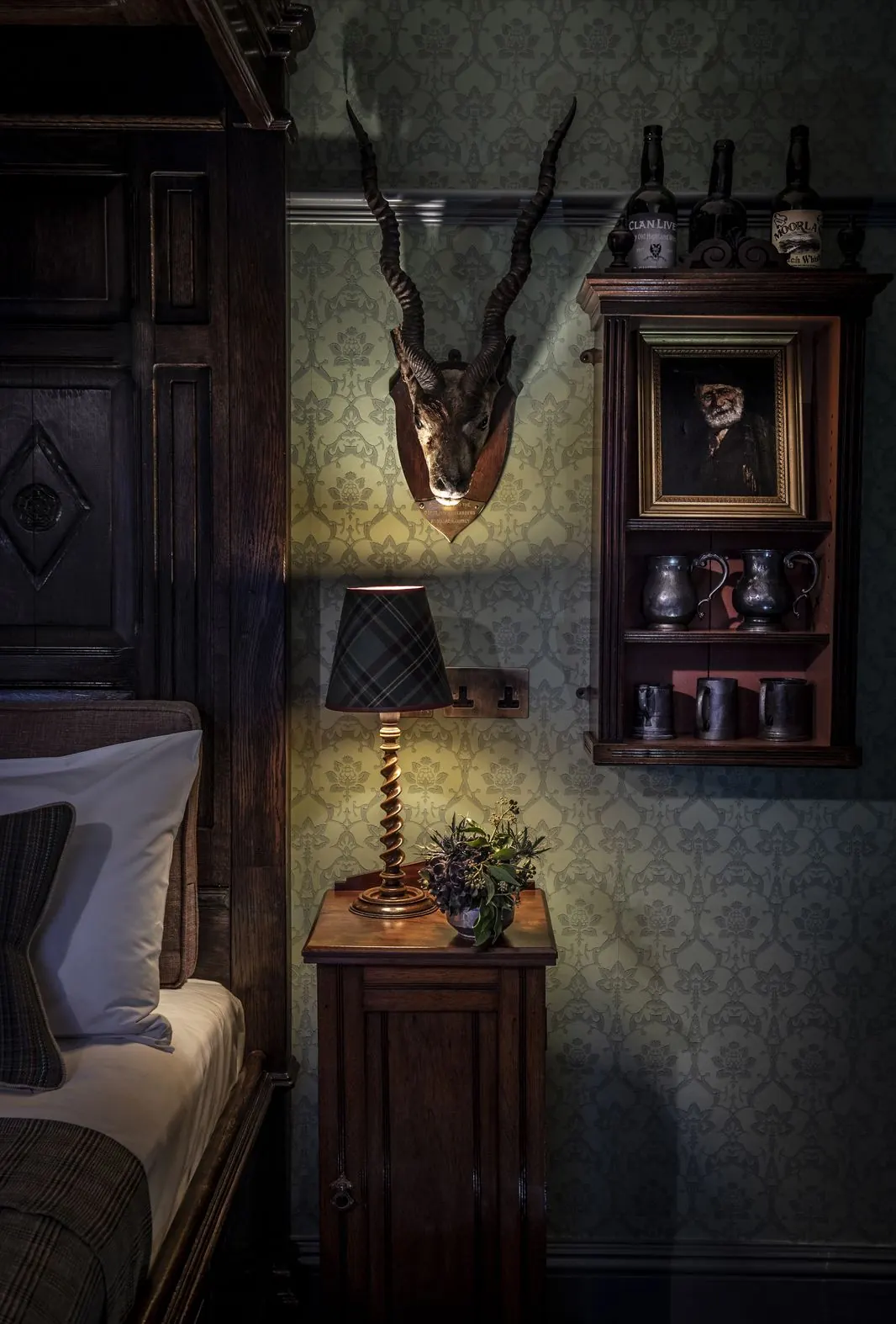 Bedroom detail with mounted antlers