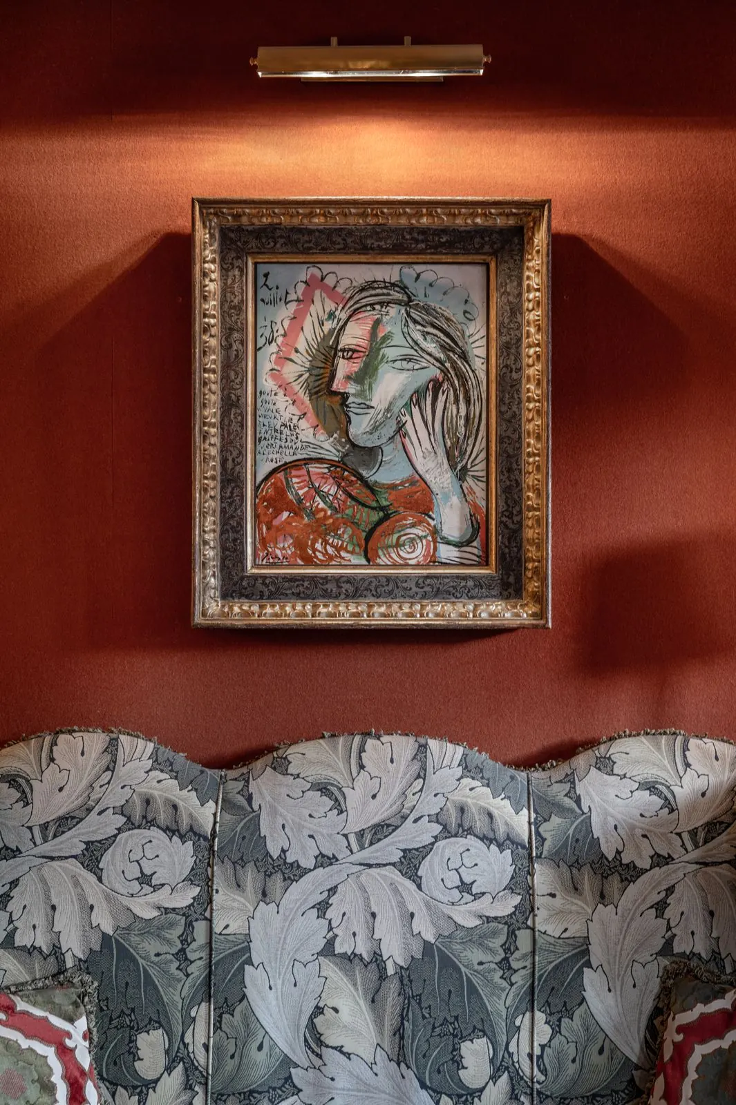 Artwork in a red-walled room