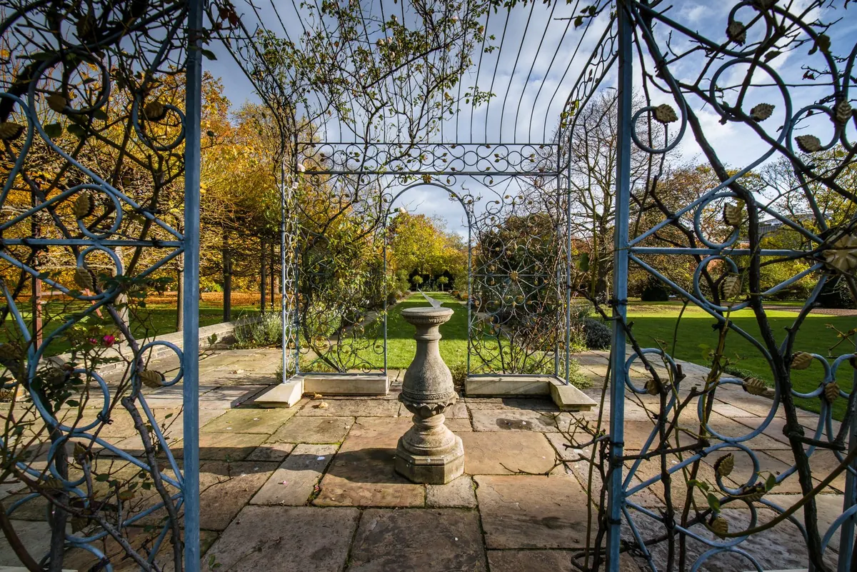 Arch and sundial in the gardens