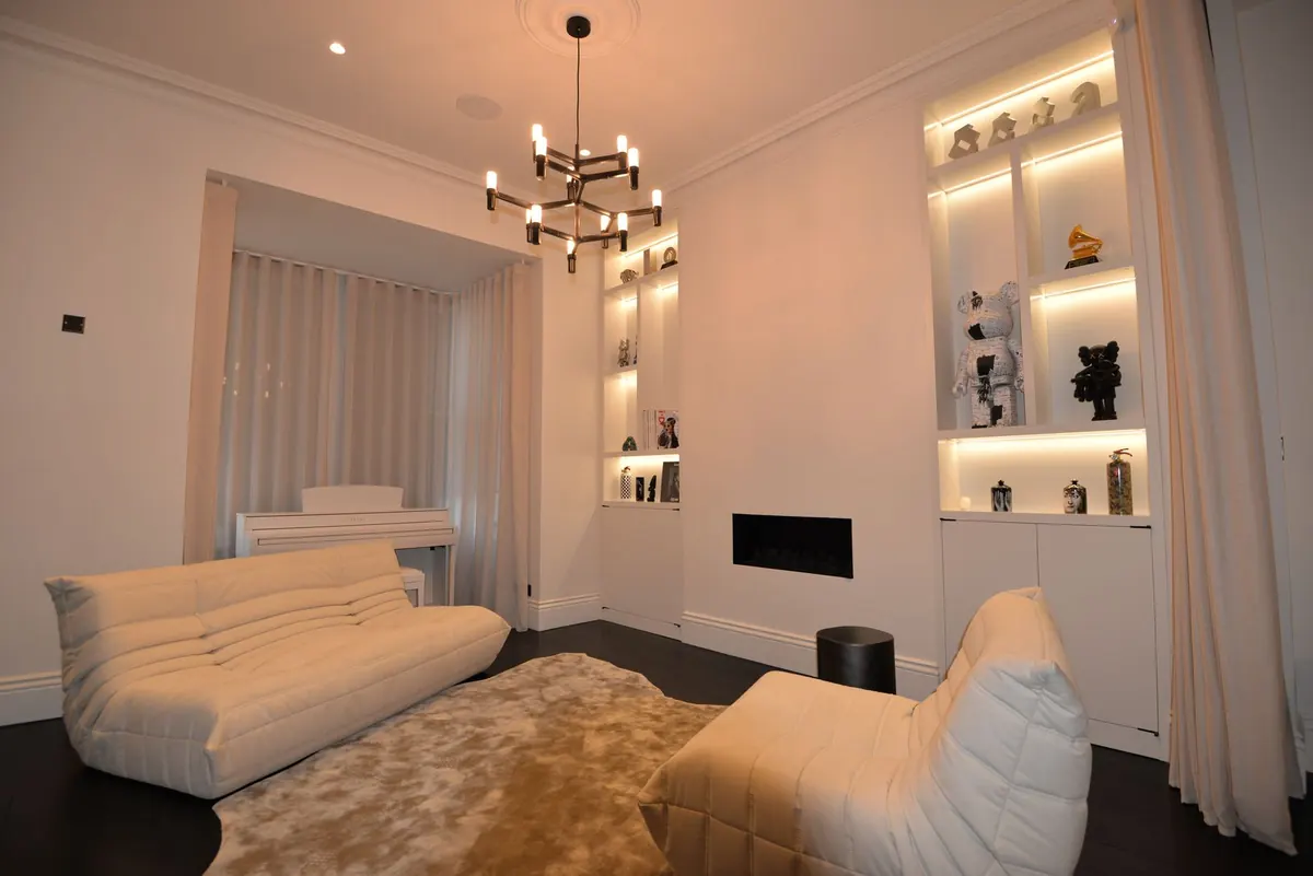 Lounge with lit shelving