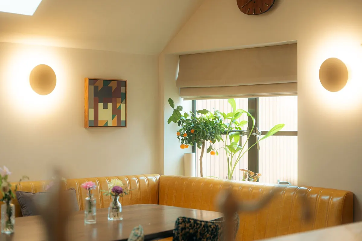 Dining nook with wall lights
